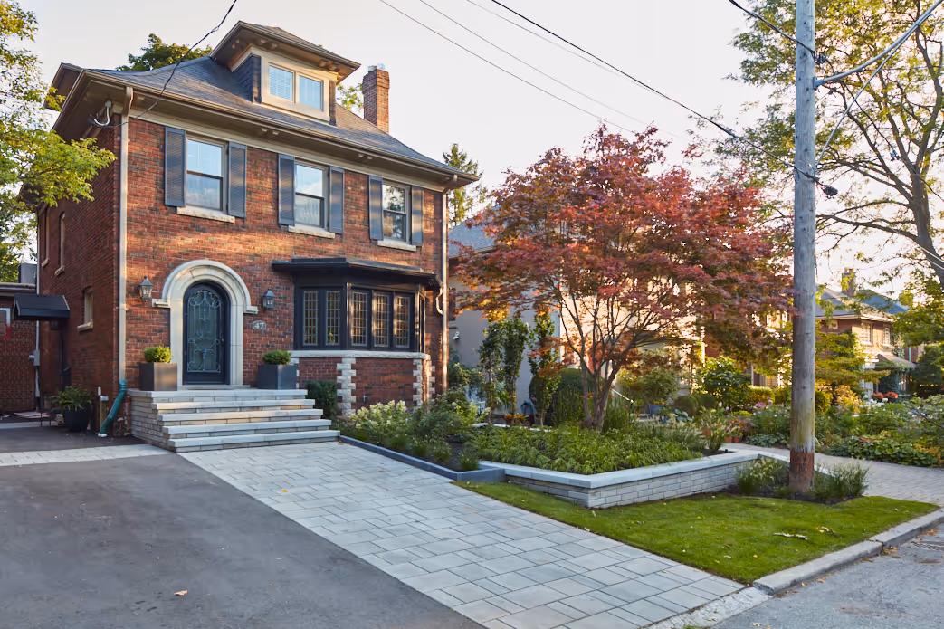 Stone Walkway leads up to matching stone retaining wall and garden beds