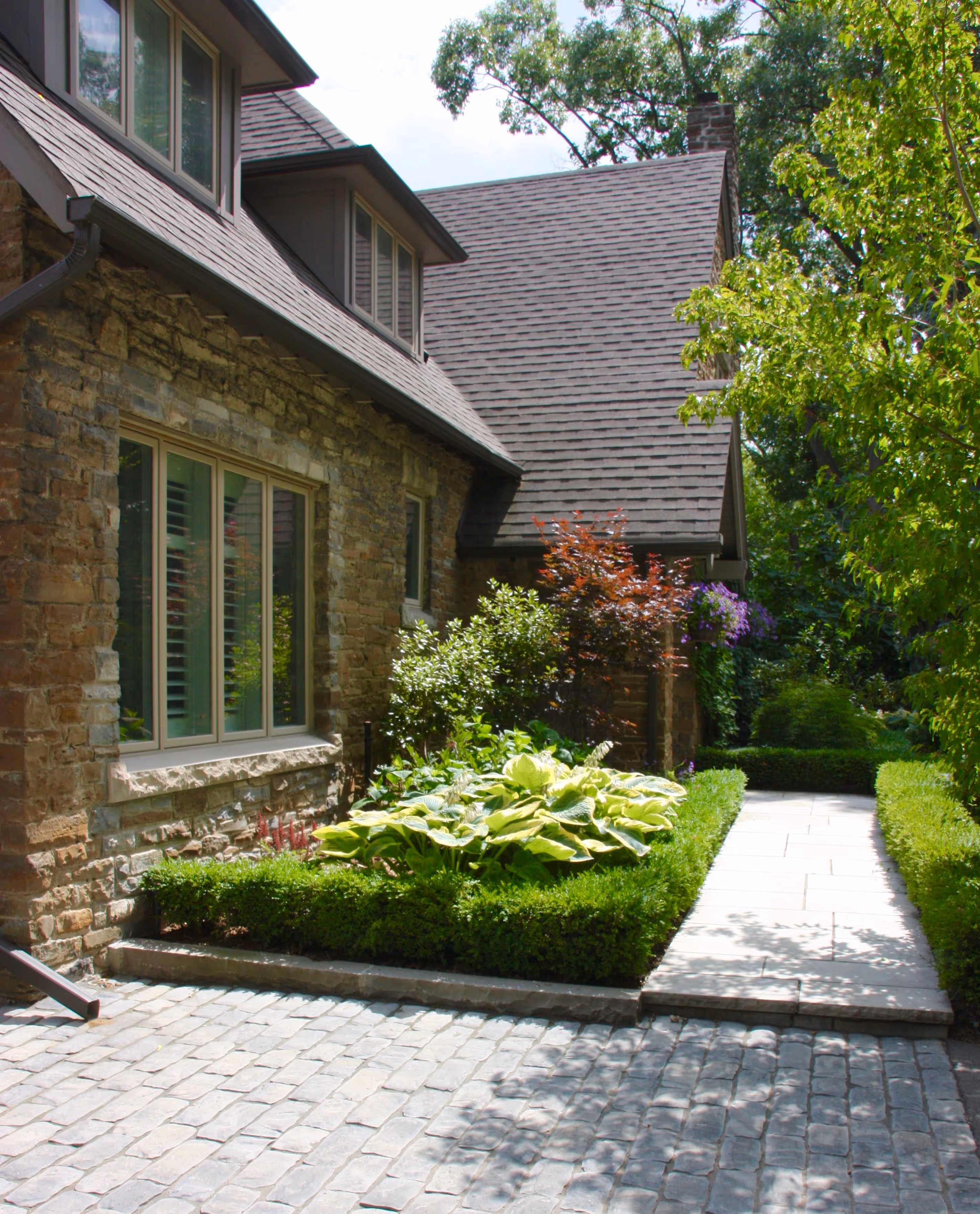 Intricate stonework up to front door separate angle