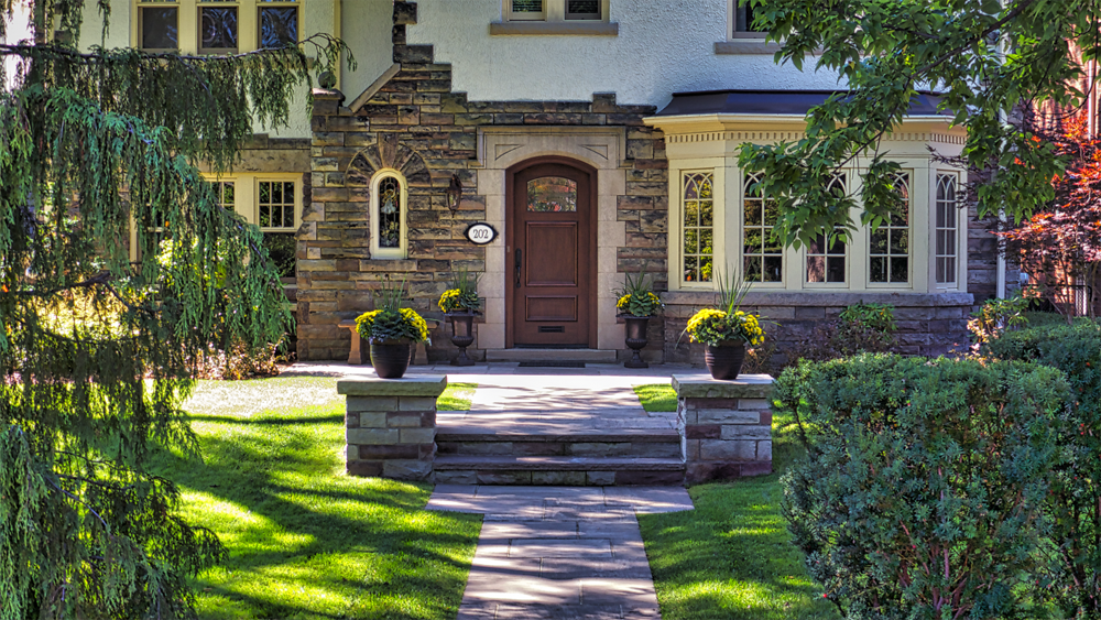 Stone Walkway through the gardens leading up to this beautiful Tudor style home