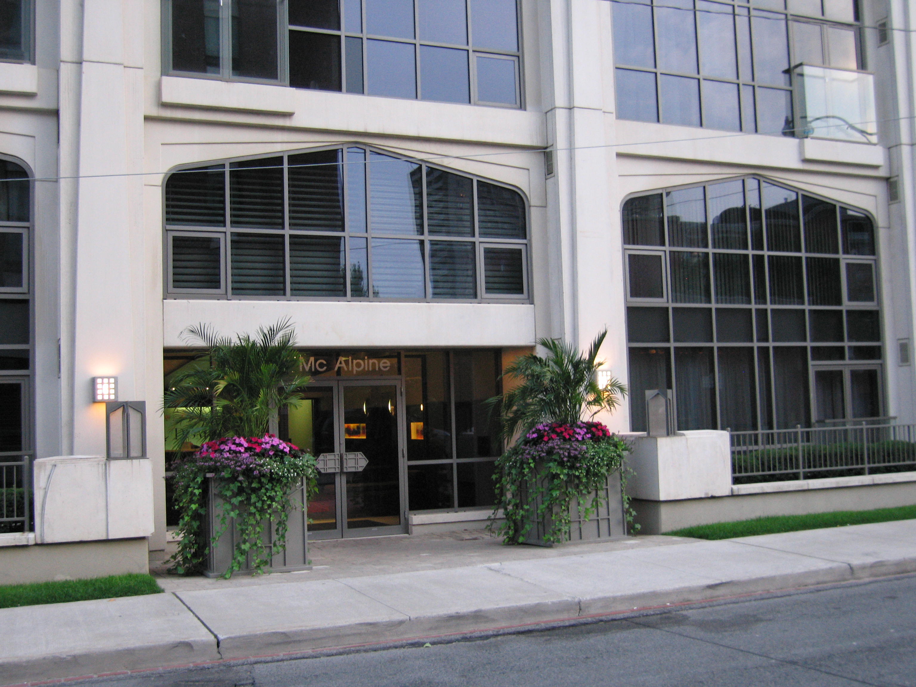 Commercial Maintenance Property front entrance with beautiful custom Urns
