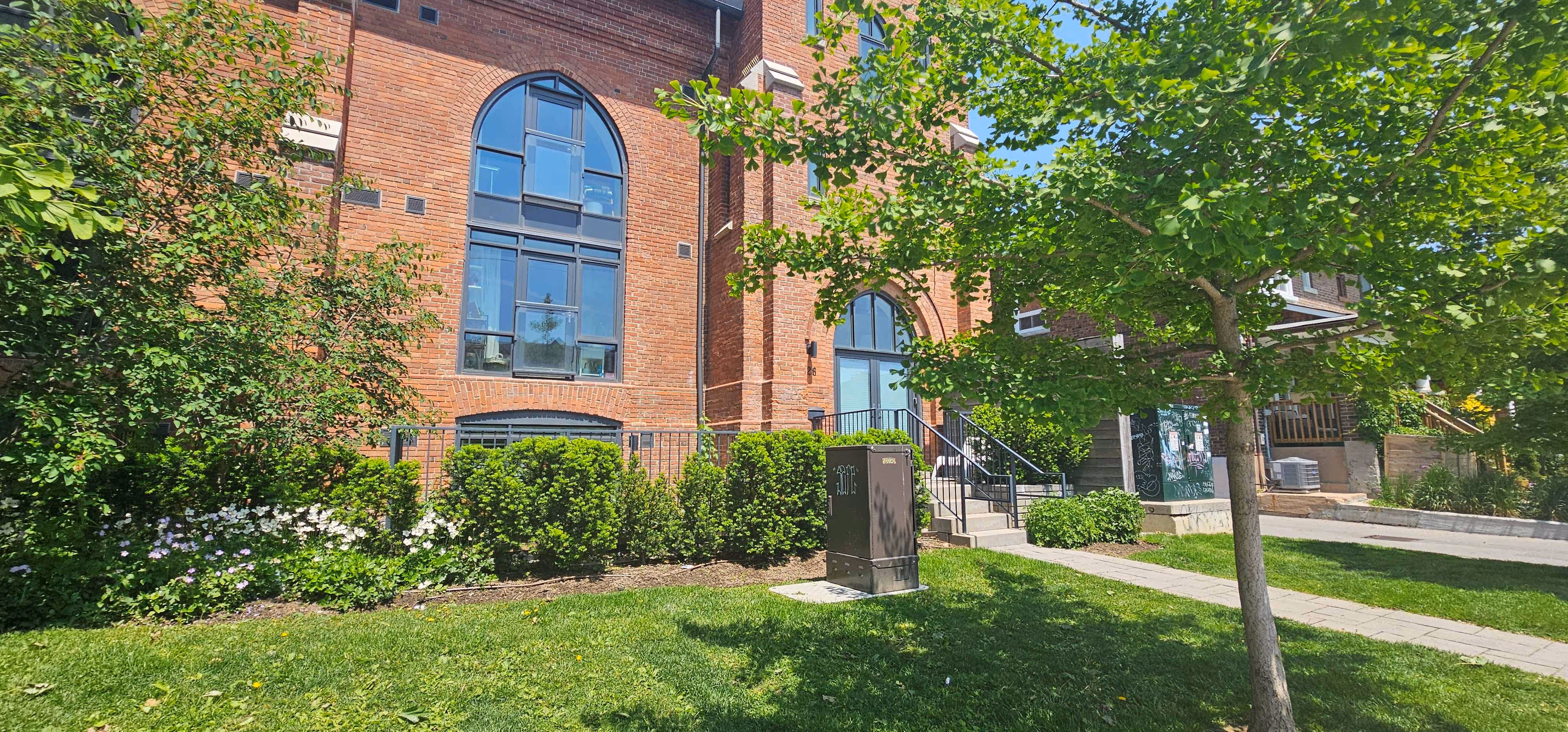 Office property entrance with lawn care, tree care and hedges