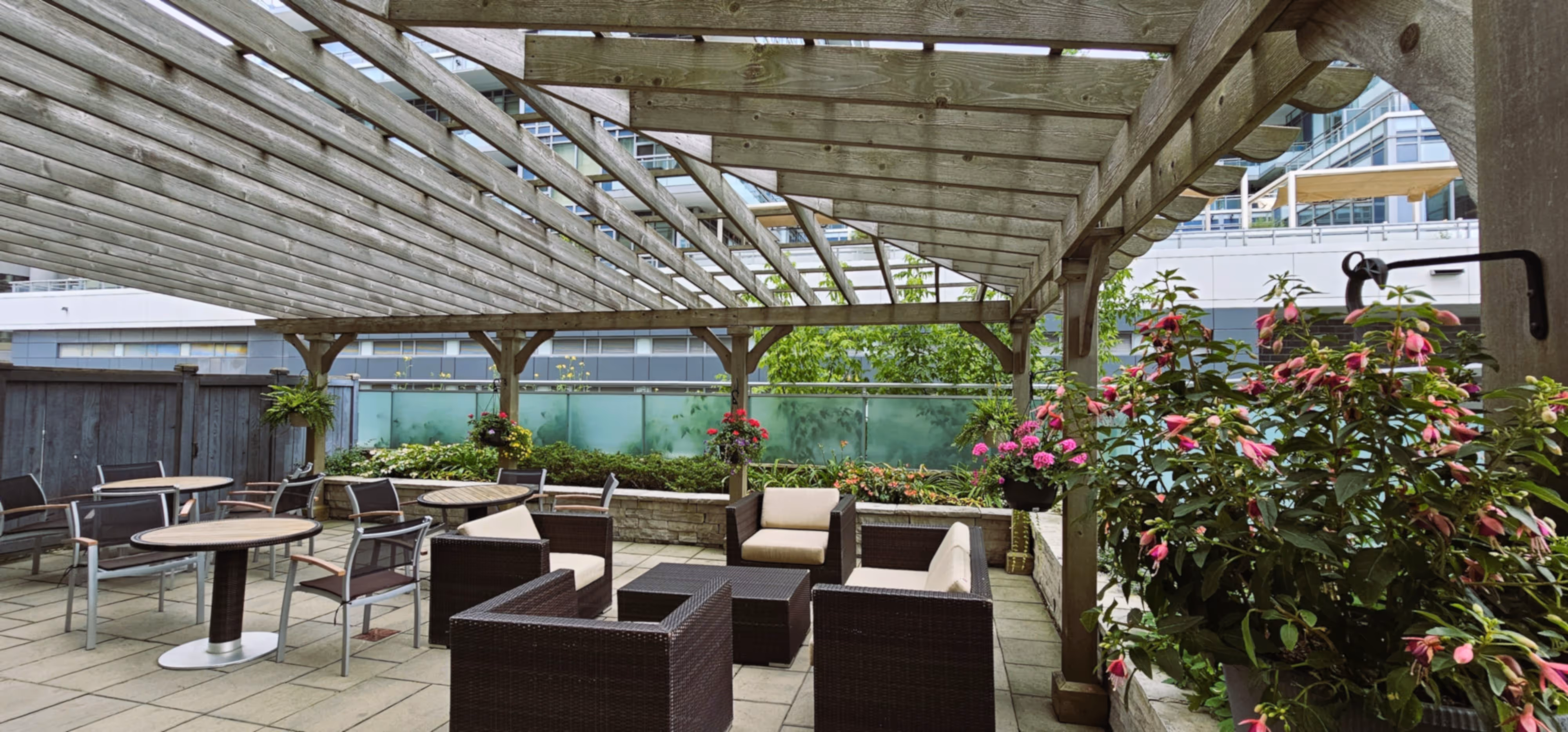 Upper rooftop patio seating area with white hydrangeas 