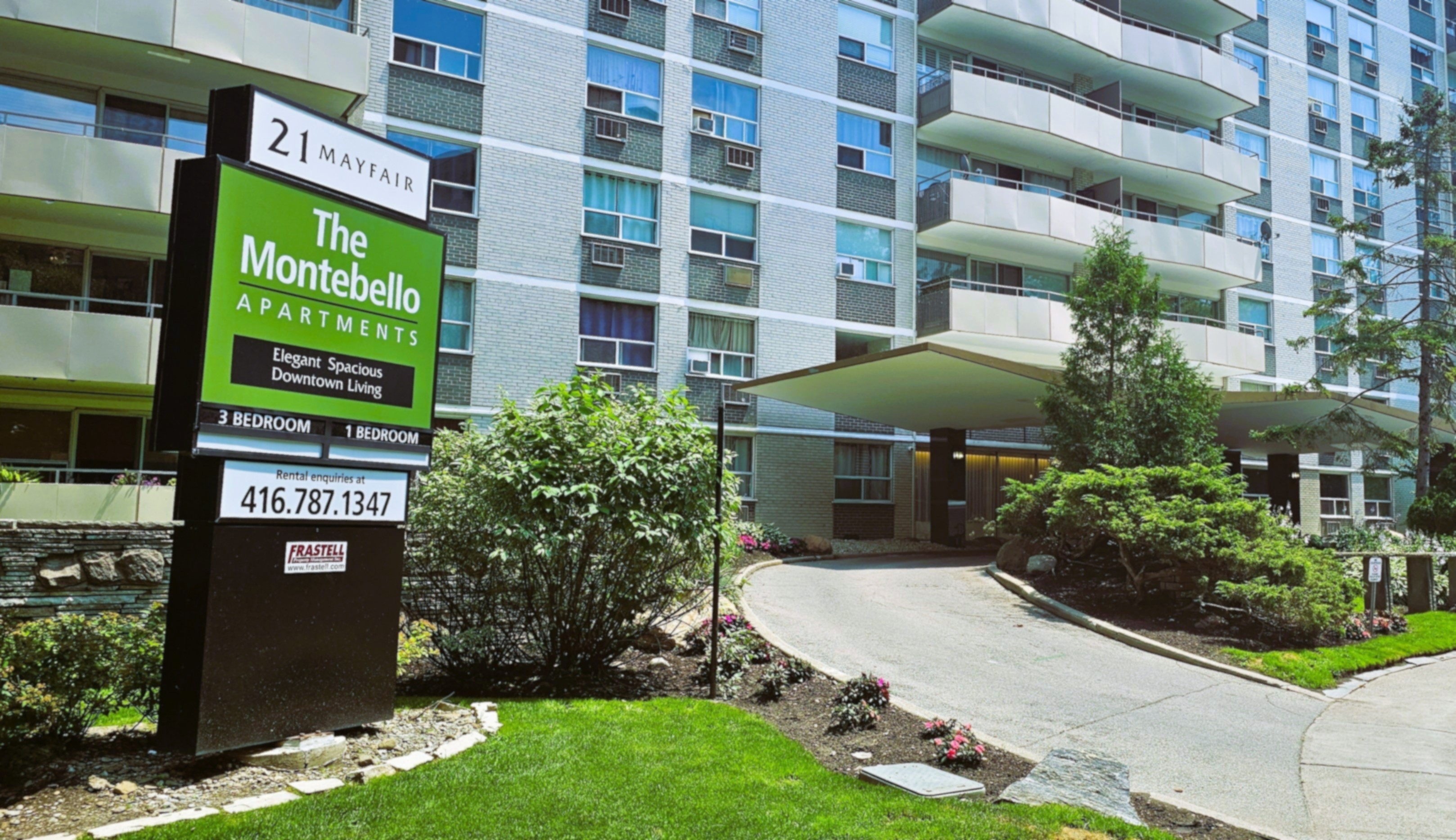 Front entryway sign and natural stone gardens