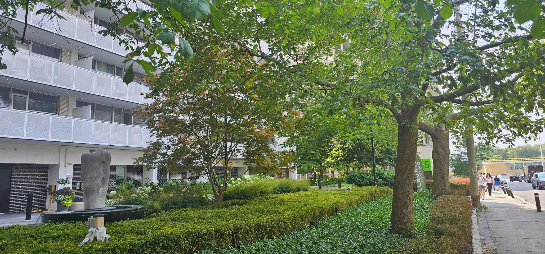 Front entryway with intricate shrubs