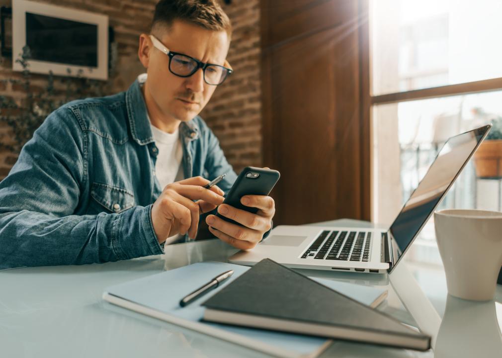 man looking at phone