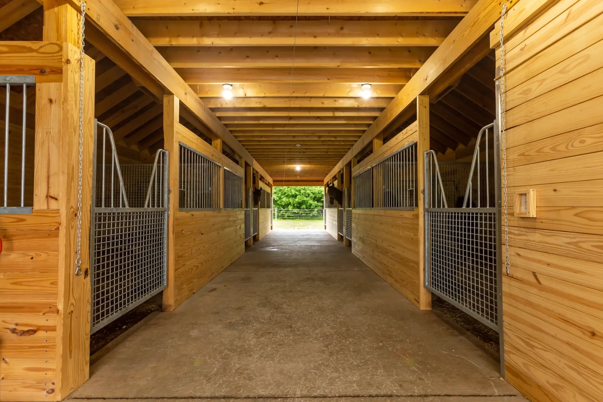 looking down middle of stall path with des eck welding stall fronts
