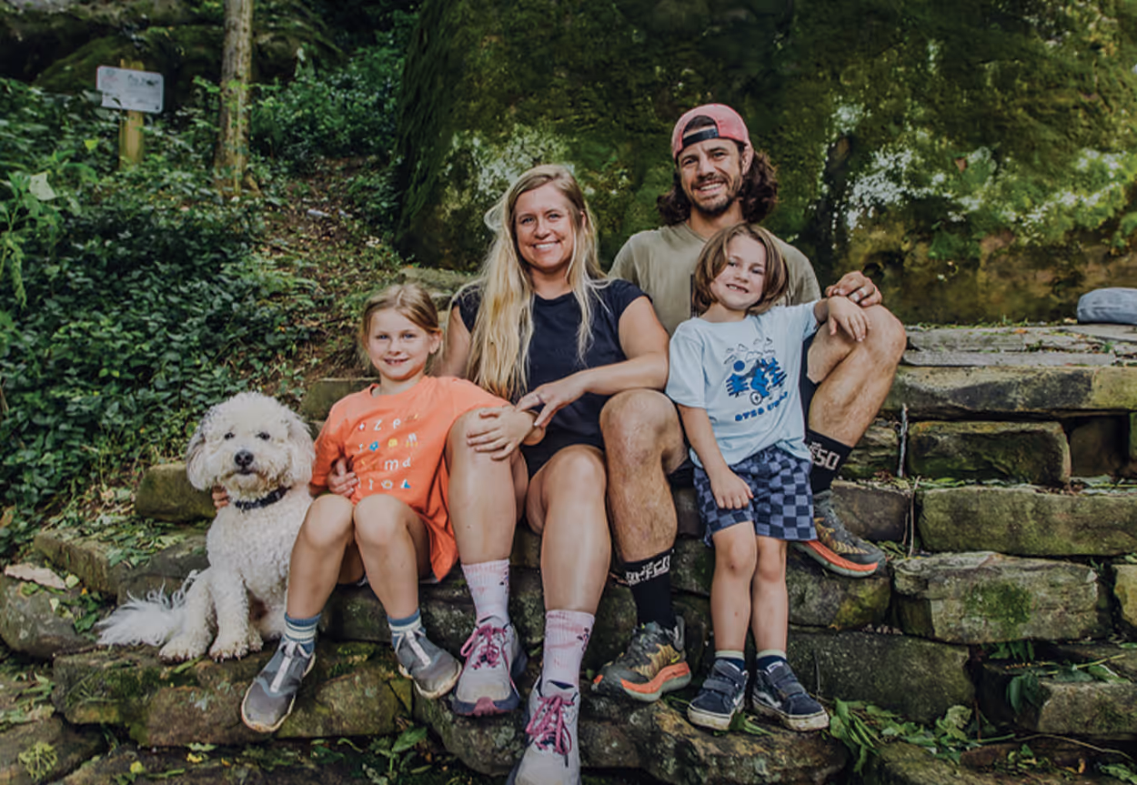 Family poses on rocks at the Lookout Mountain Conseervancy
