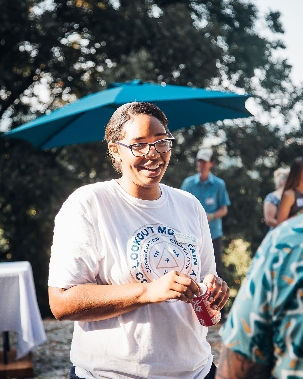 Lookout Mountain Conservancy interns from Howard High School climbing a boulder