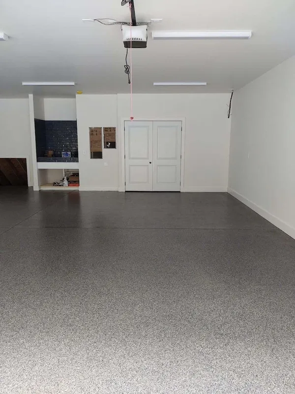 A full new epoxy garage floor installed in Asheville, covering wall to wall. 