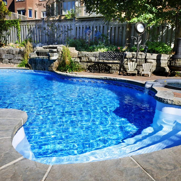 outdoor pool with water feature  in Amarillo Texas by Lone Star Luxury Pools