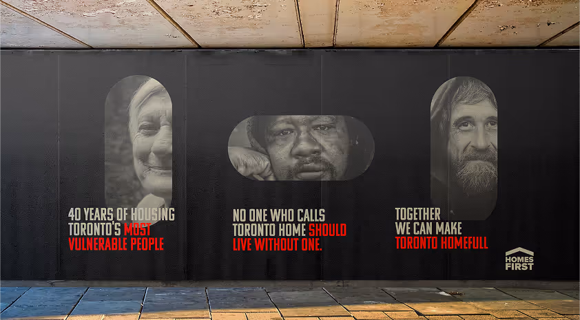 A horizontal street level billboard for homes first.