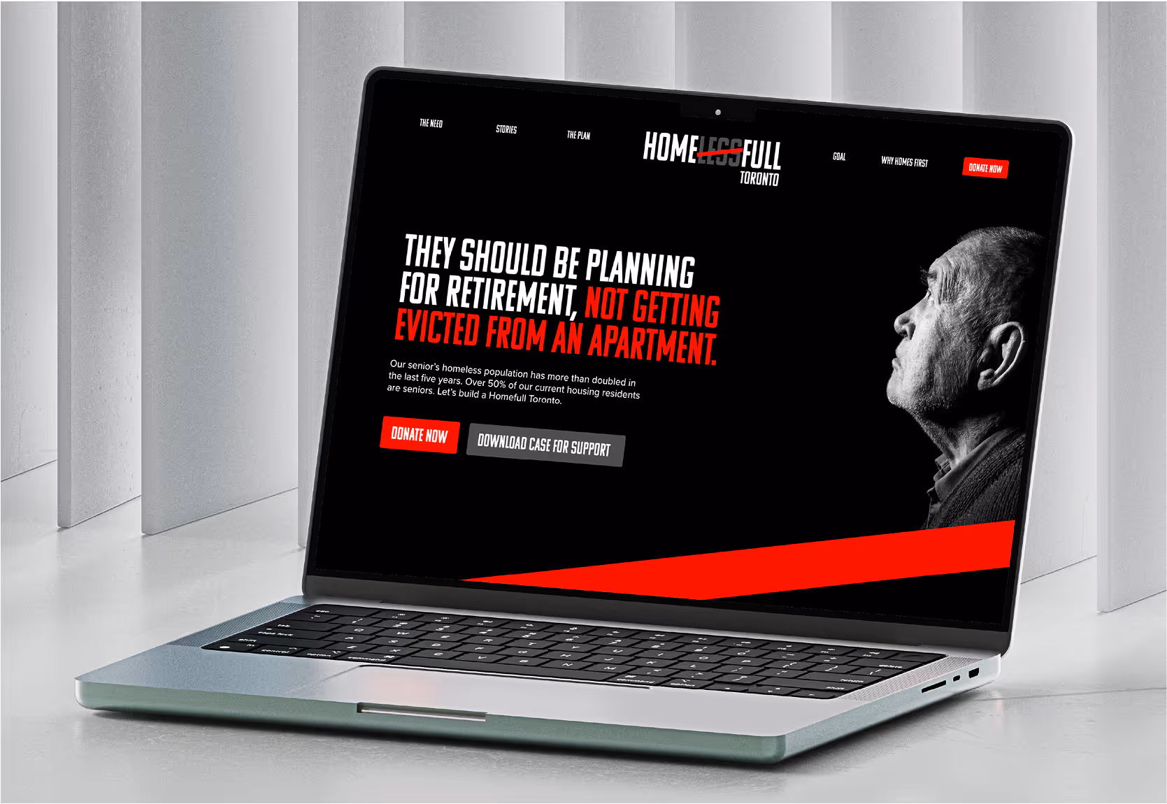 An image of a MacBook showcasing the homes first website.