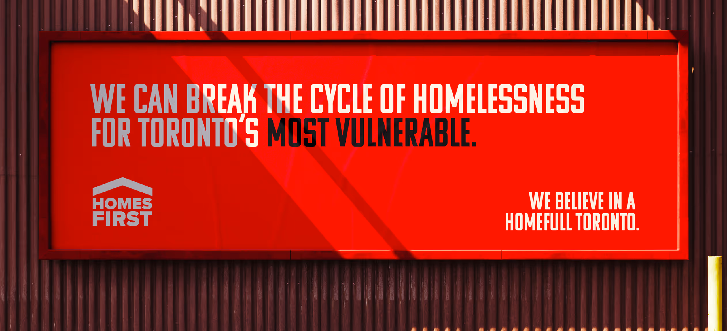 A red homes first billboard.