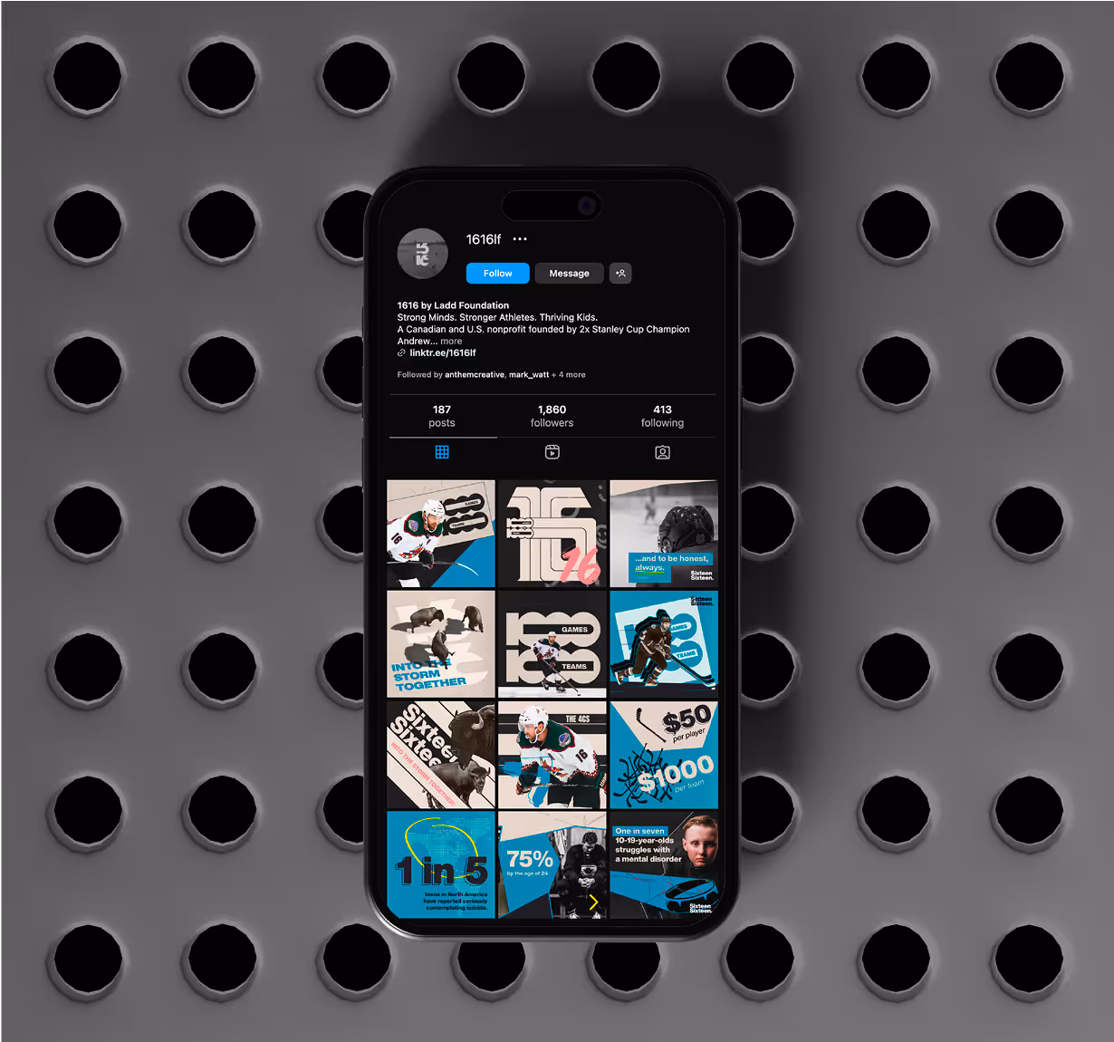 A top down image of an iPhone on a steel surface showcasing the 1616 Instagram grid. 