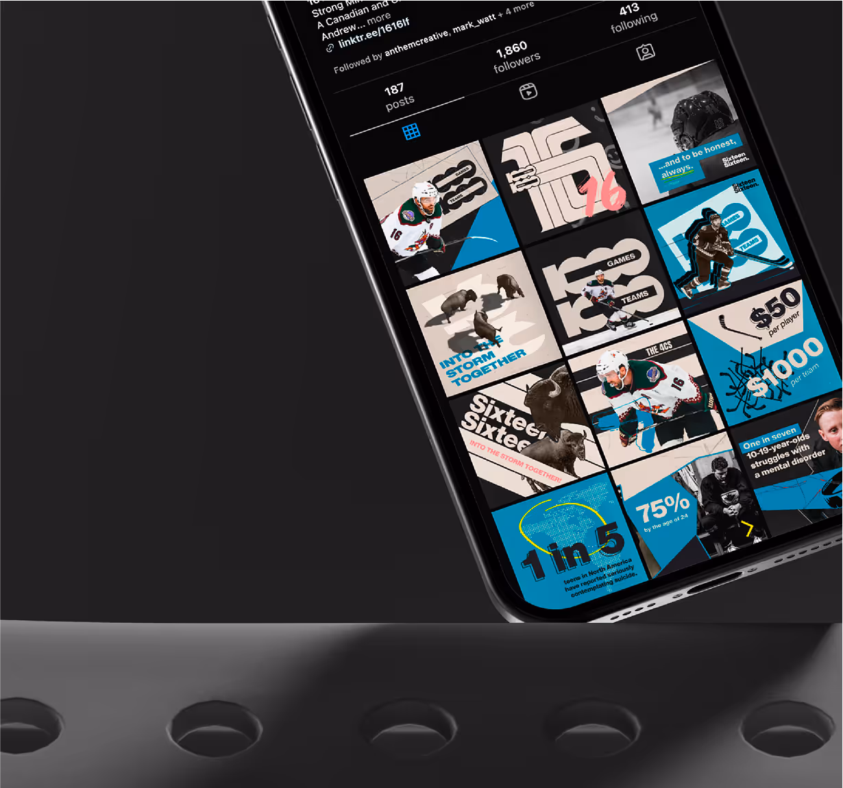 A close up image of an iPhone on a steel surface showcasing the 1616 Instagram grid. 