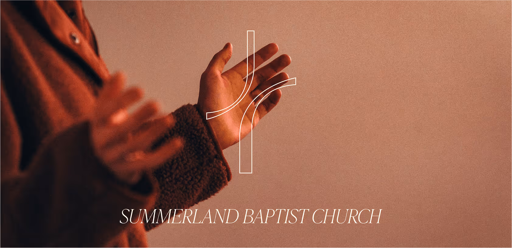 A image of a lady raising her hands in church.
