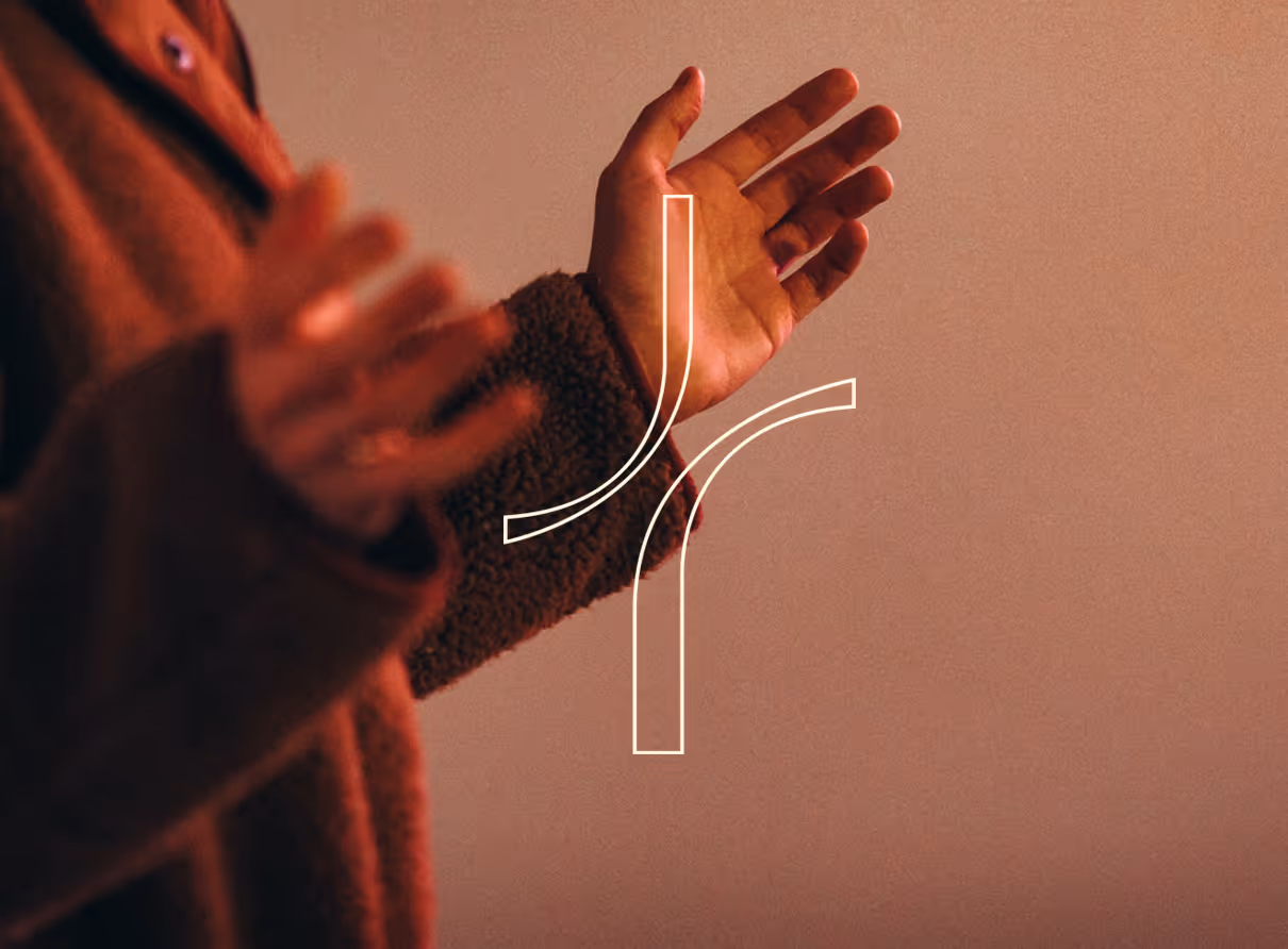 open hands at sunset