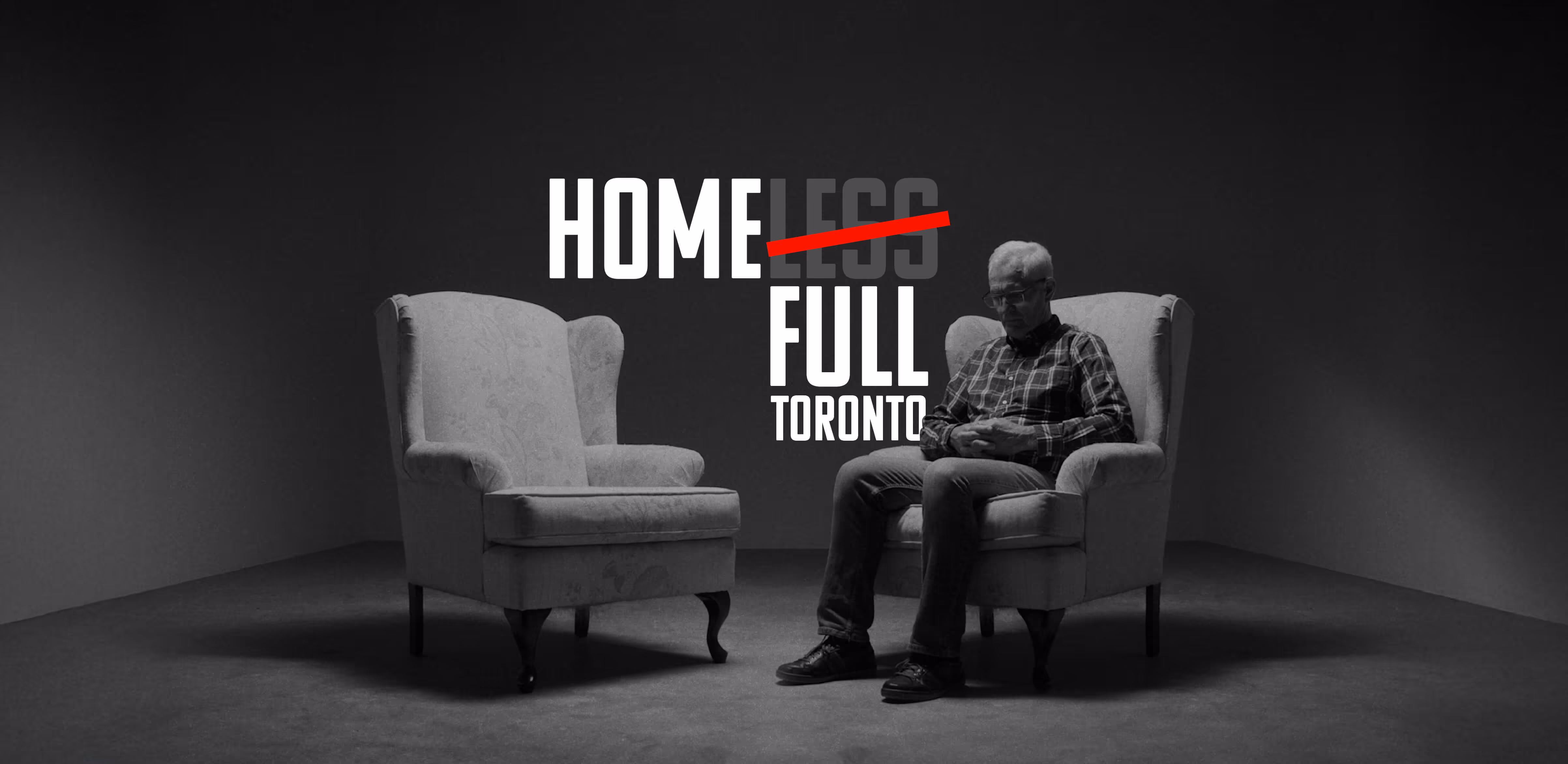 An elderly man sitting on a chair 