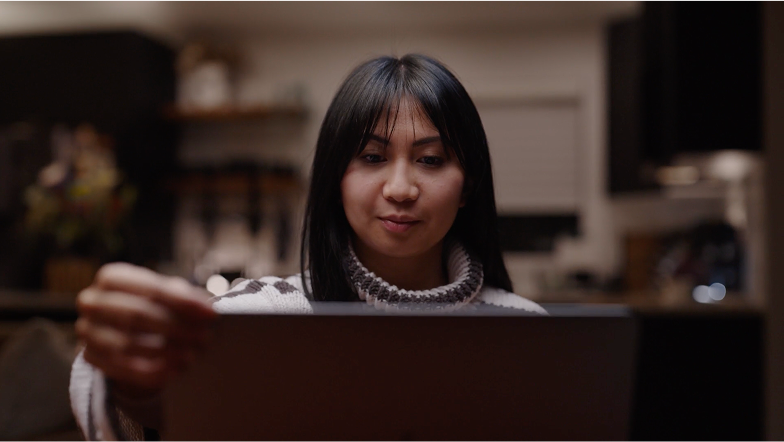 An image of a lady on a zoom call.