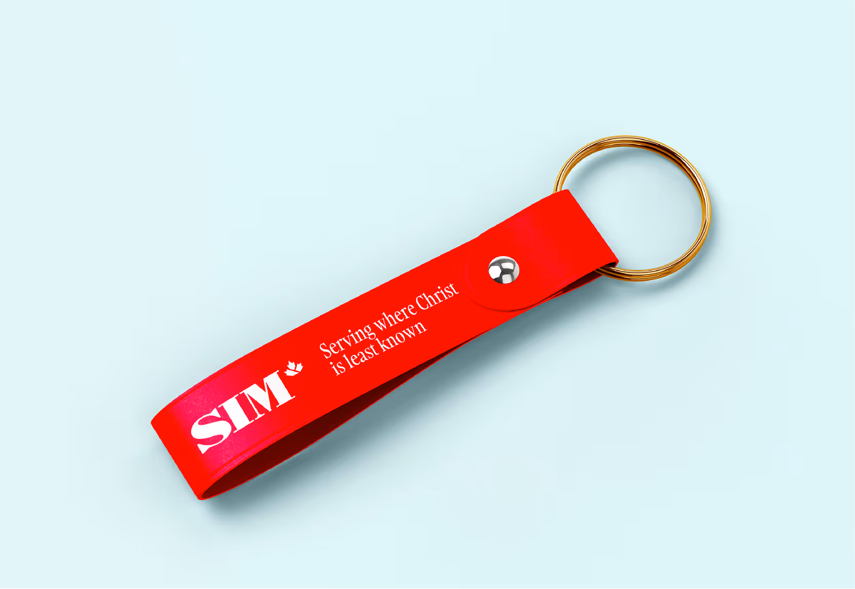 A mockup image of a SIM Canada branded keychain.