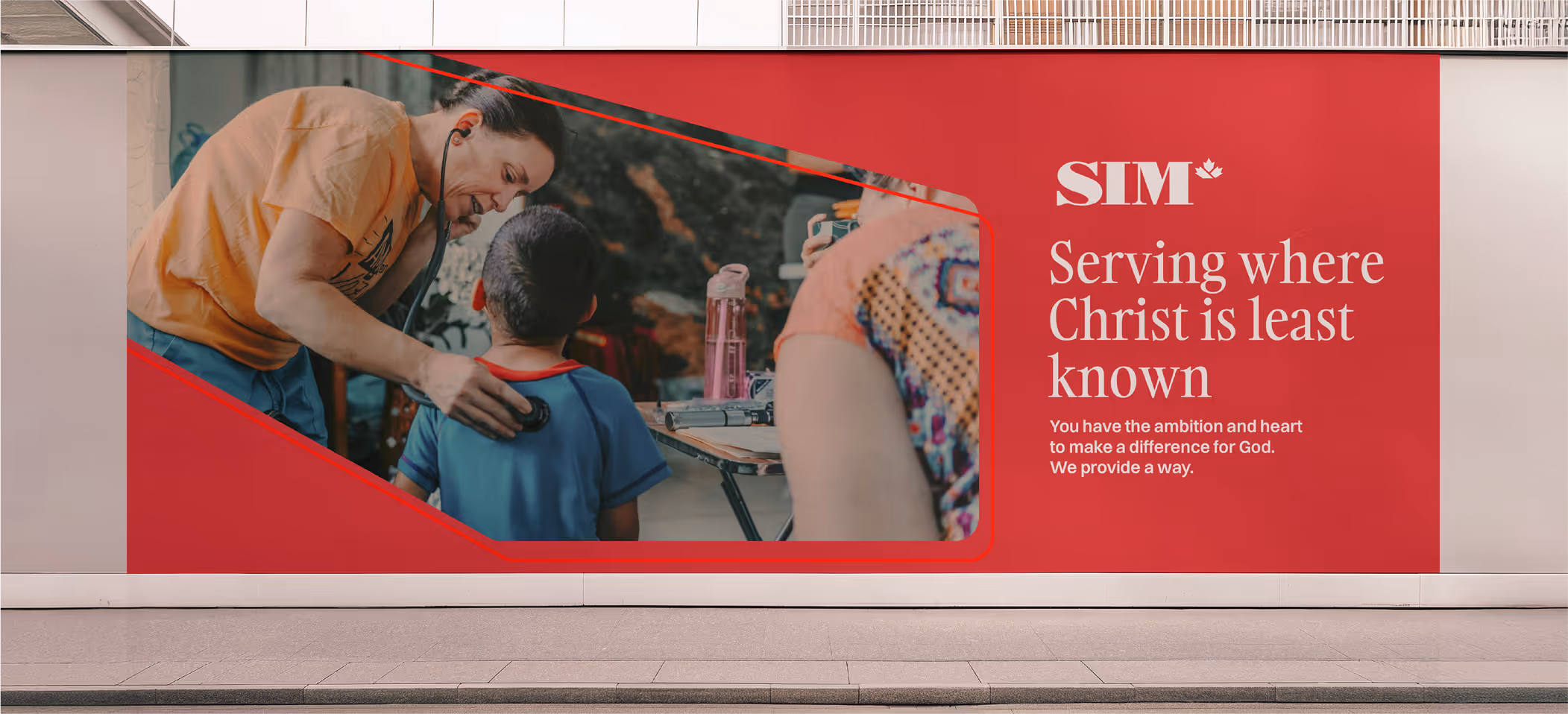 An image of a SIM branded street-level billboard