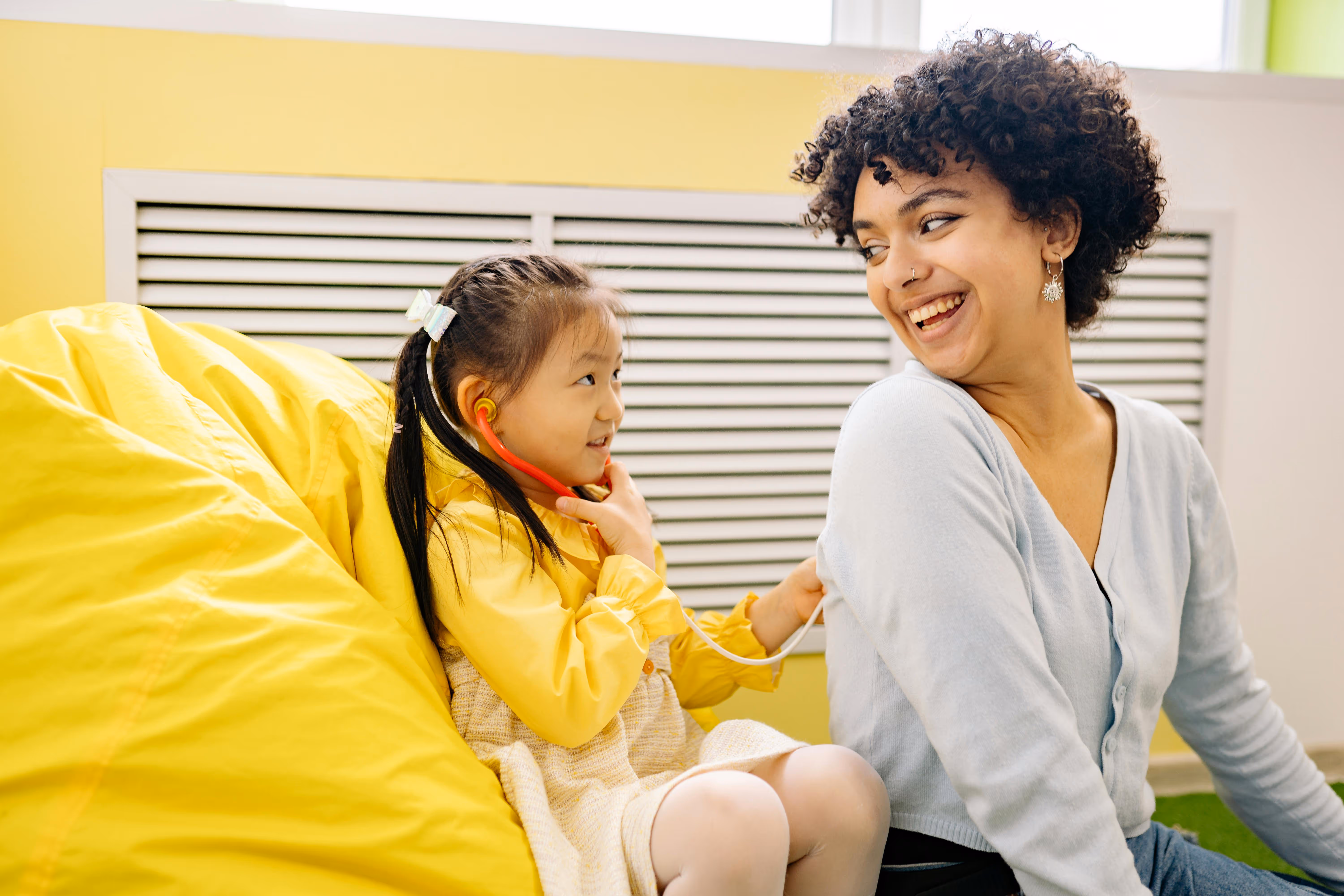 Nurse and girl smiling