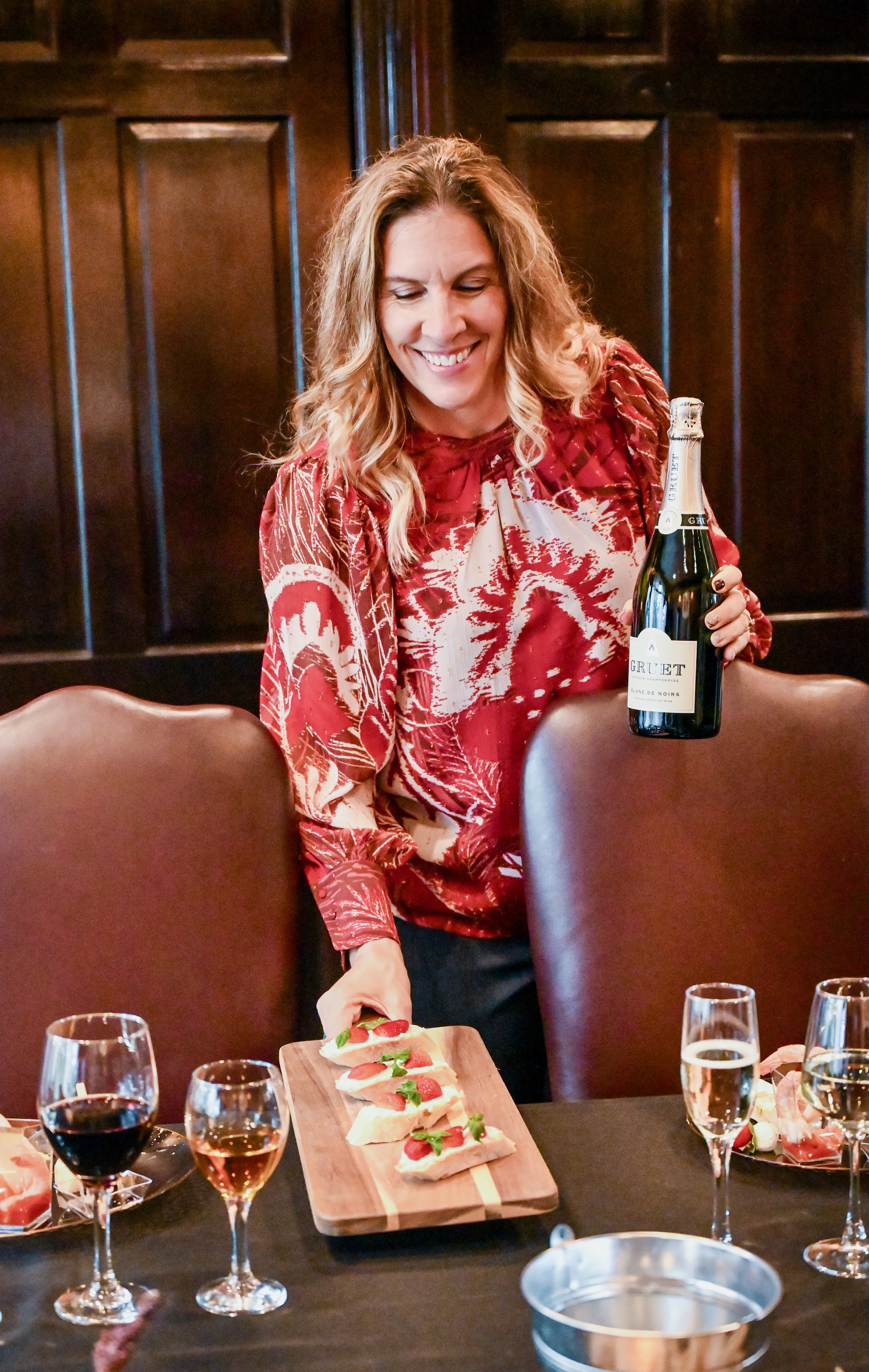 Jill's Keiken wine tasting with appetizers and cheerful smile