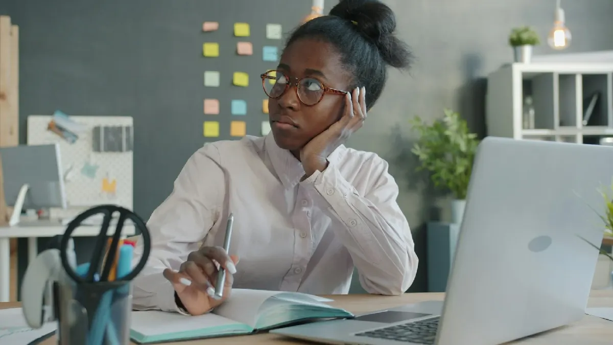 Concerned employee at a laptop, reflecting workplace mental health issues that HR often overlooks