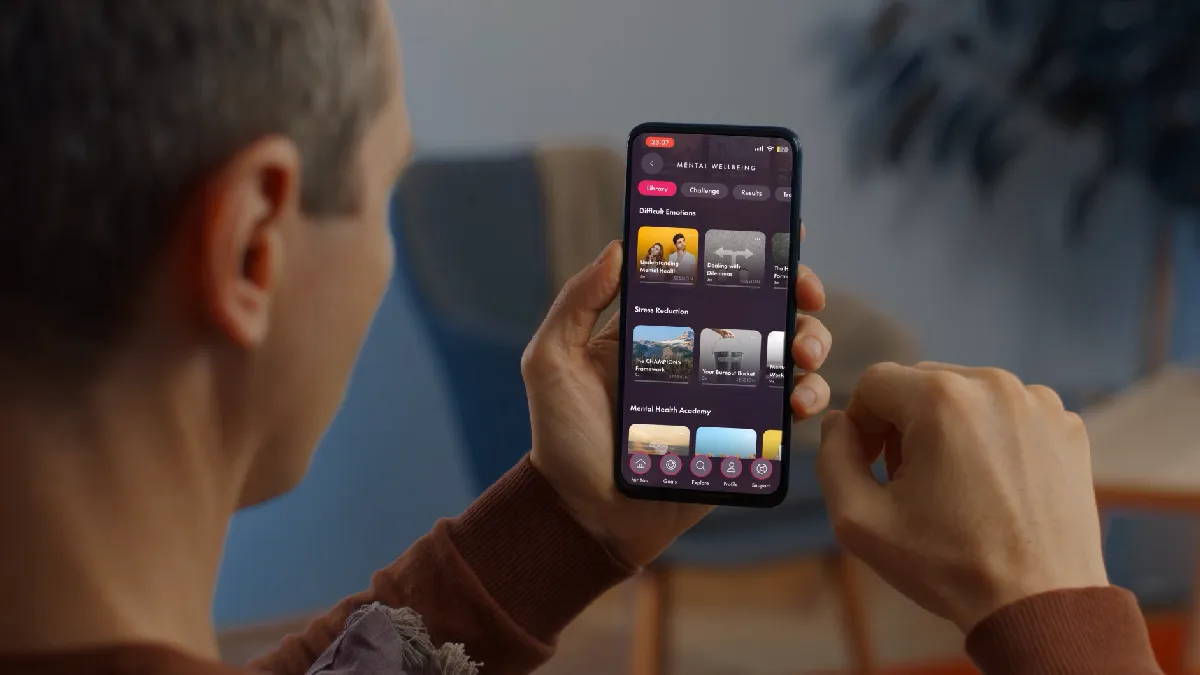 Person using Champion Health’s app, one of the best employee wellbeing platforms in the UK for 2026