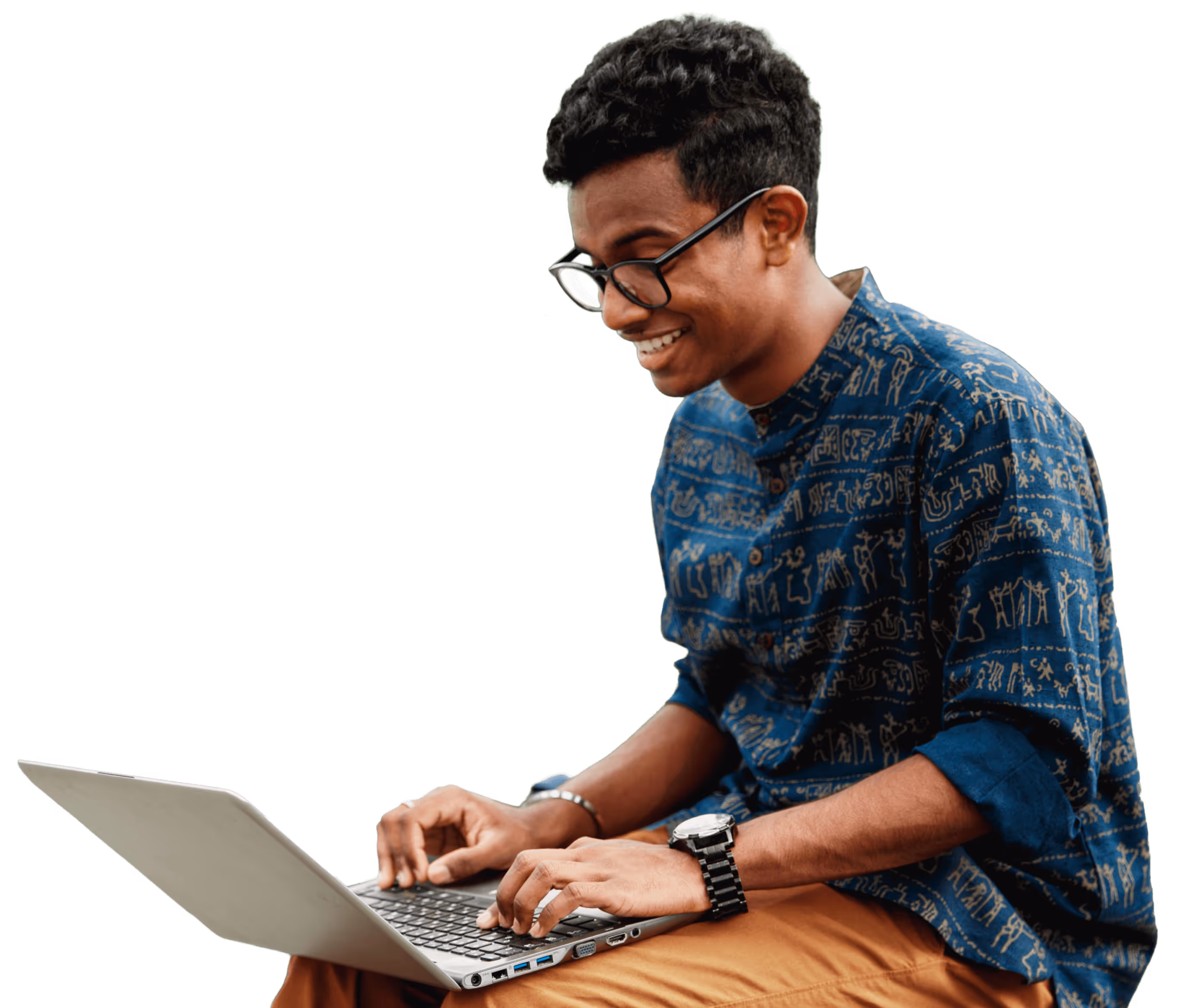 Student smiling while sitting outside, using a laptop.