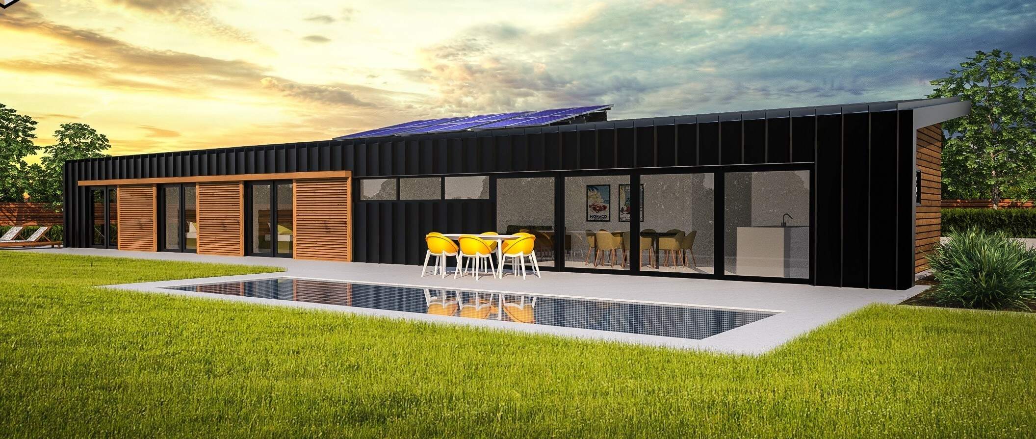 Modern black and wood house with large windows, yellow chairs, and a pool, set in a grassy area under a dramatic sunset sky.