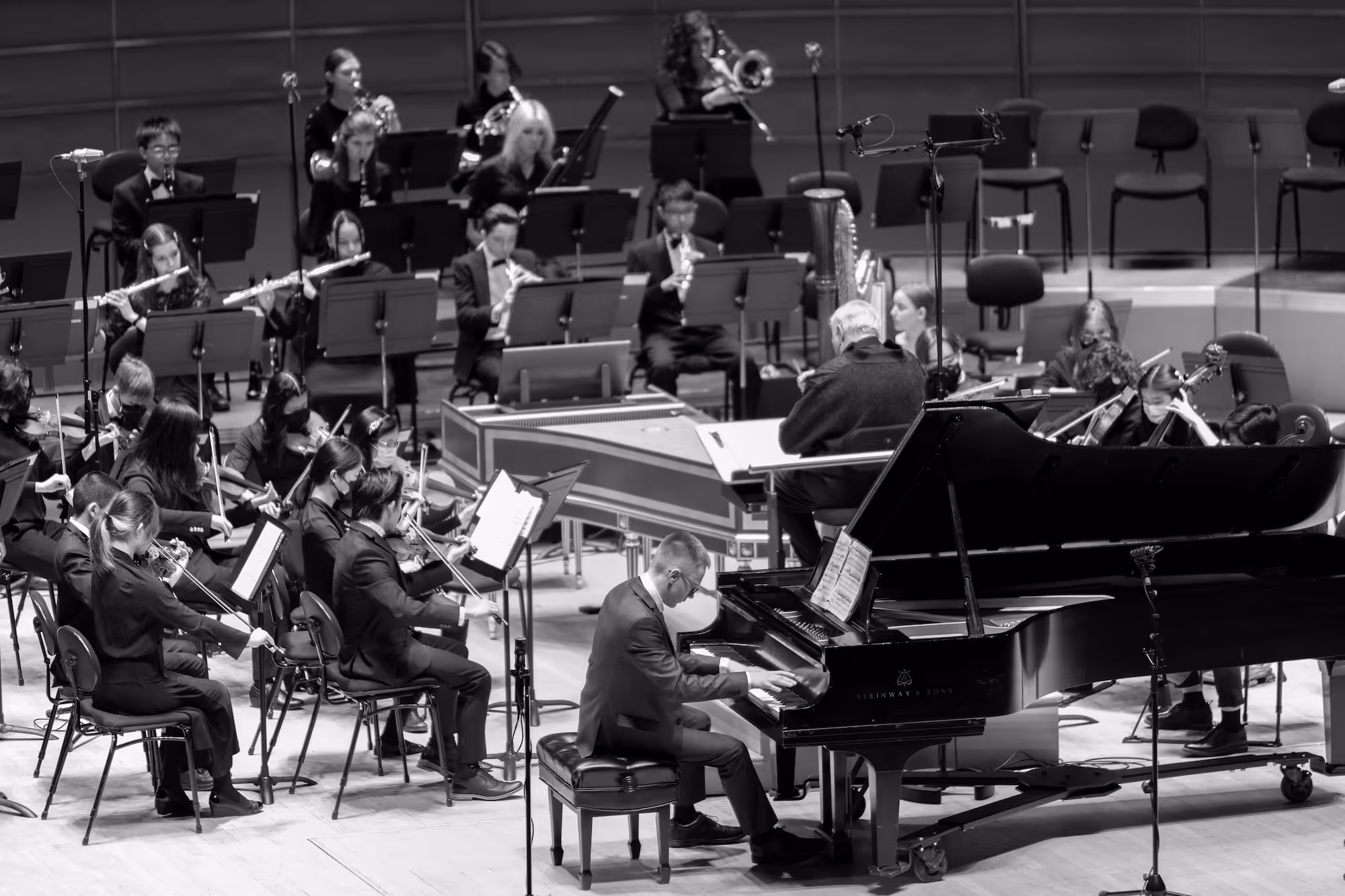 Orchestra performing with a piano