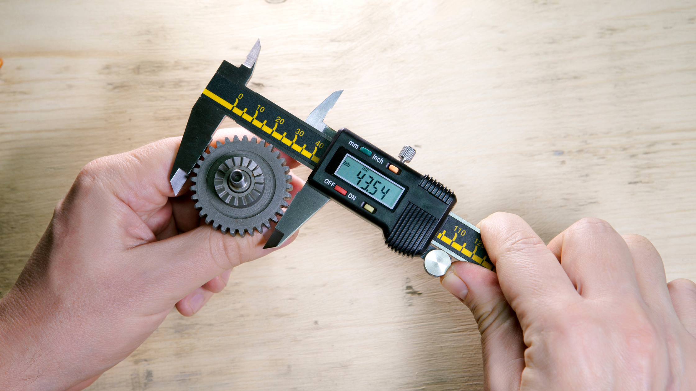 A tolerance measuring tool measuring a part