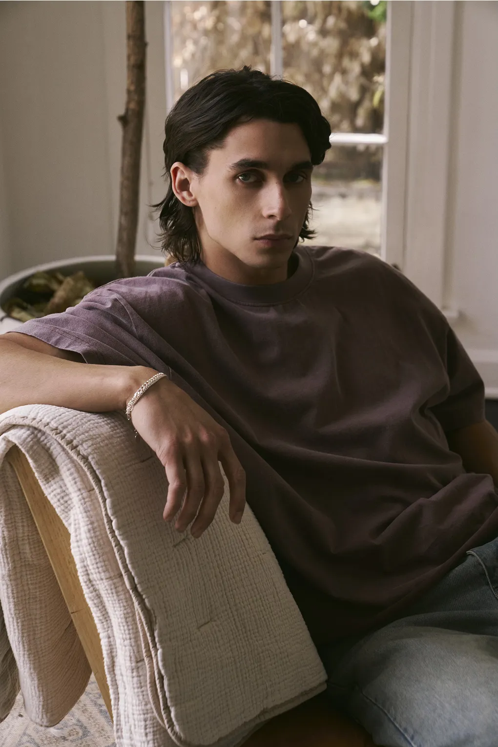 Stylish man in a brown t-shirt