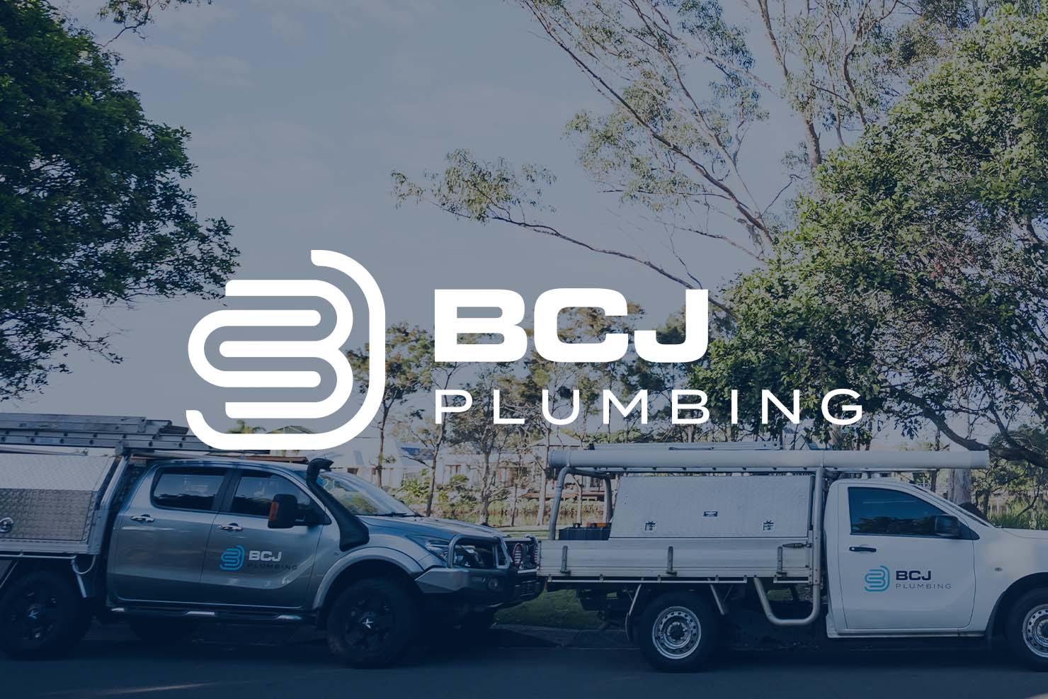 BCJ Plumbing logo on image of utes