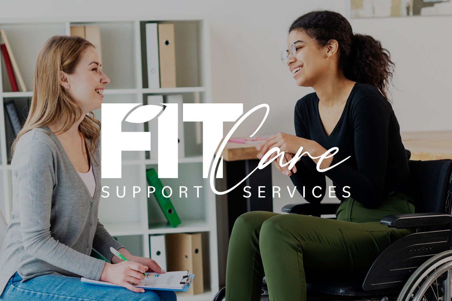 FITCare logo on image of support worker talking to patient