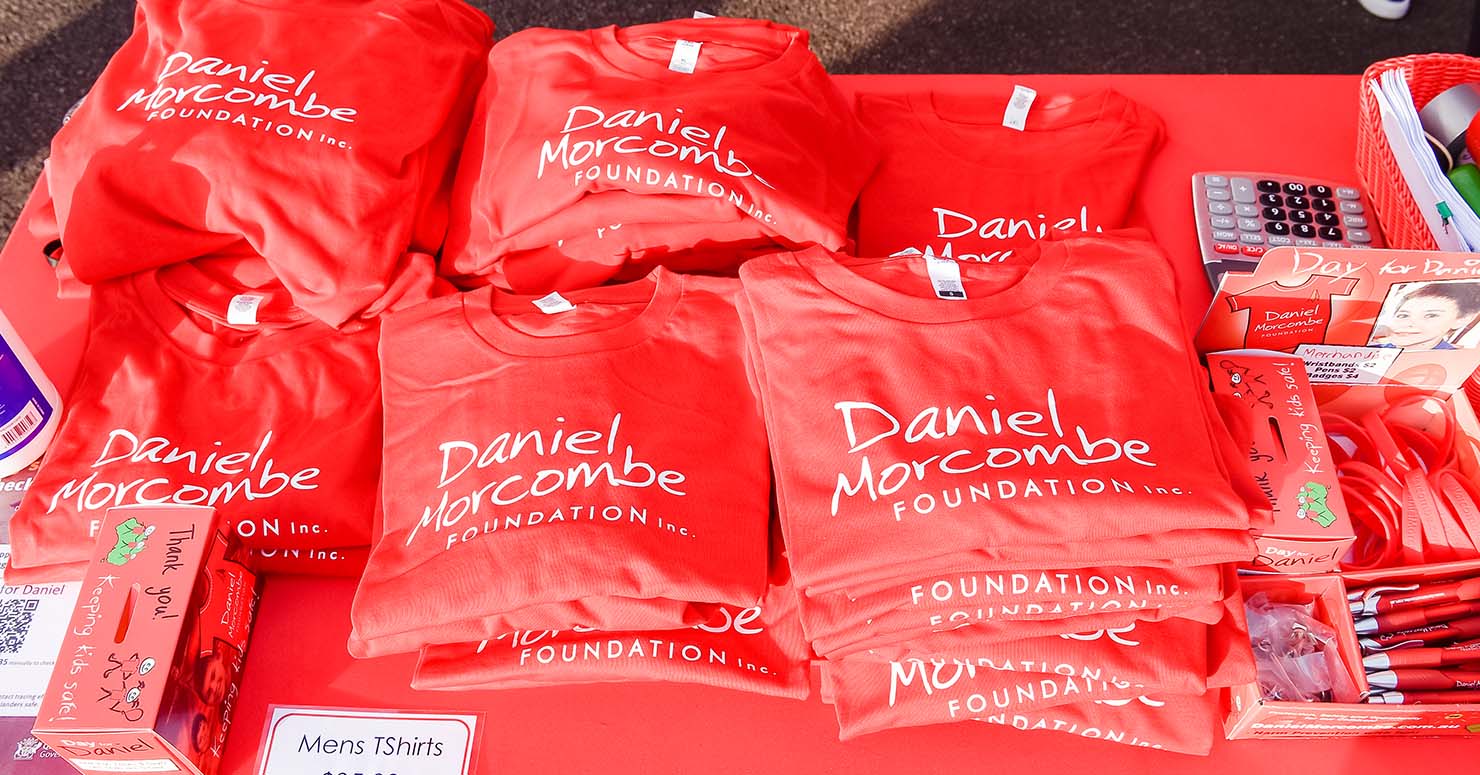 daniel morcombe tshirts on table