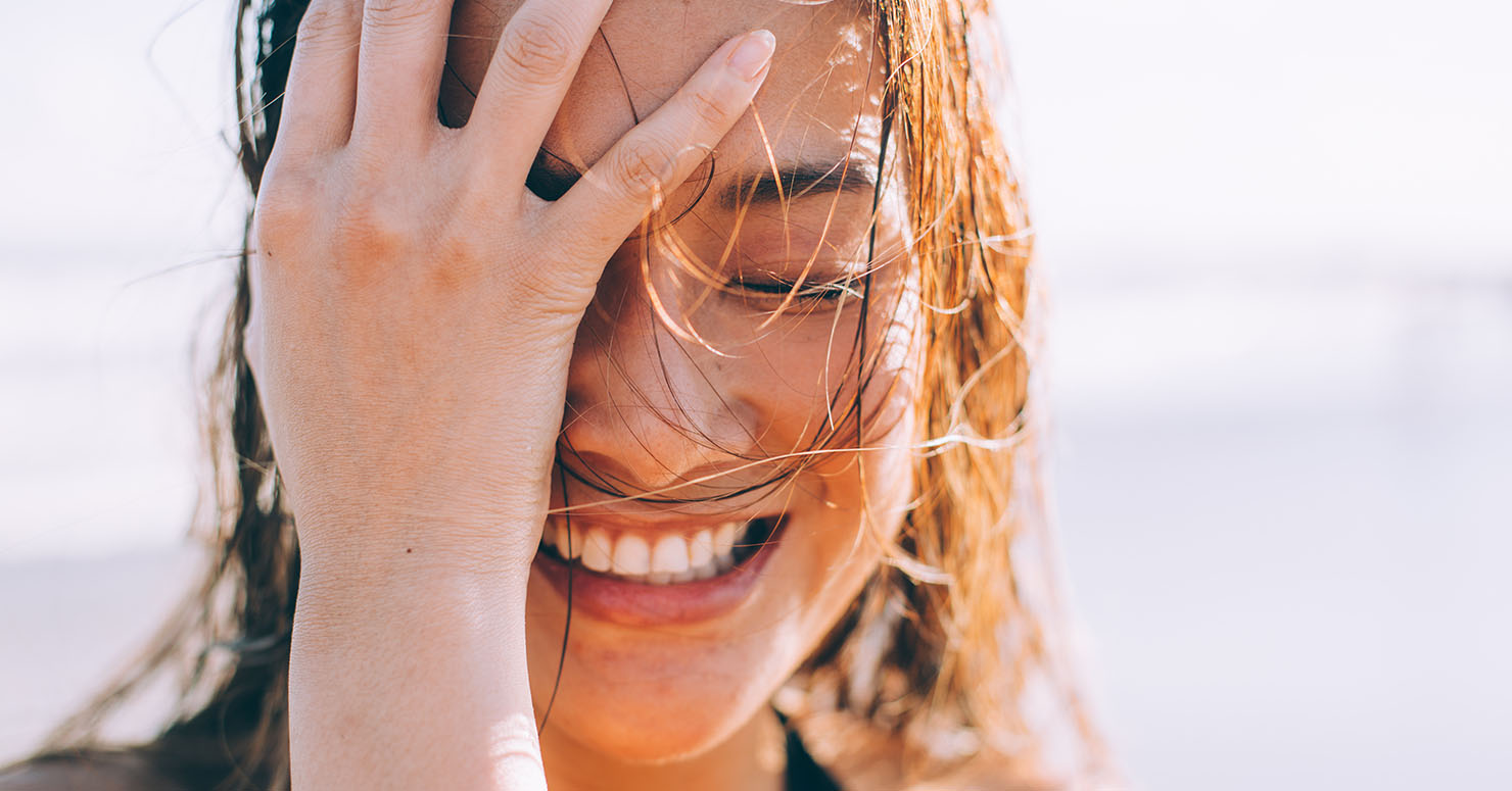 woman smiling on beach
