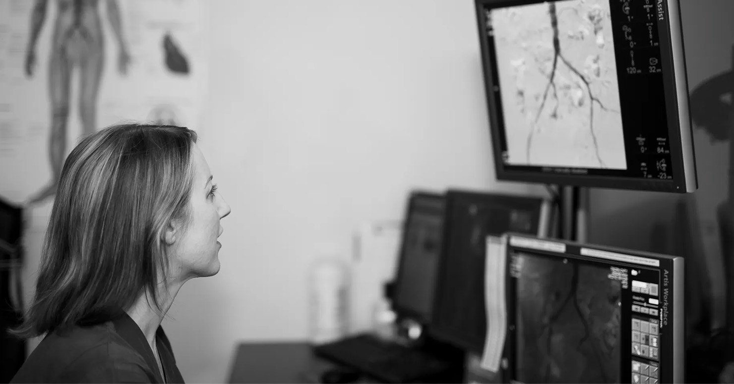 doctor looking at monitor