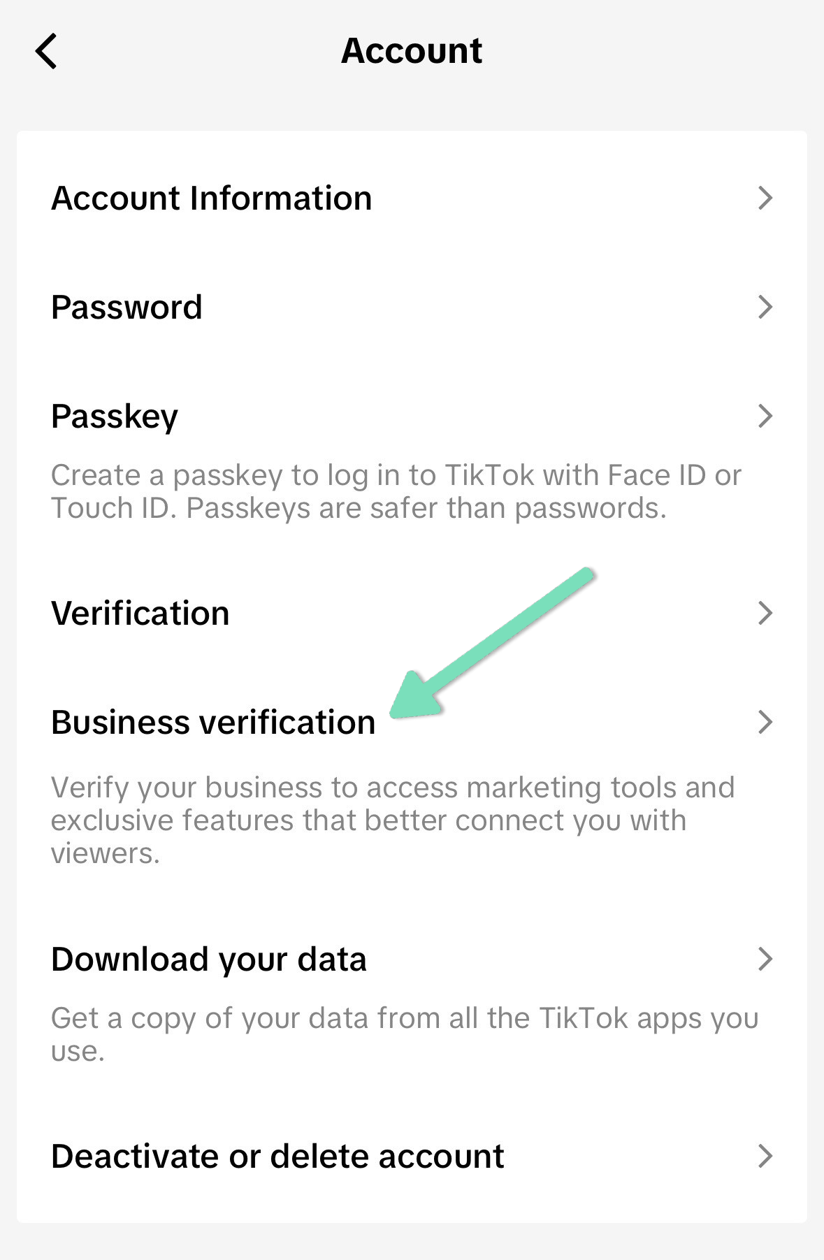 TikTok account settings with an arrow pointing to Business verification
