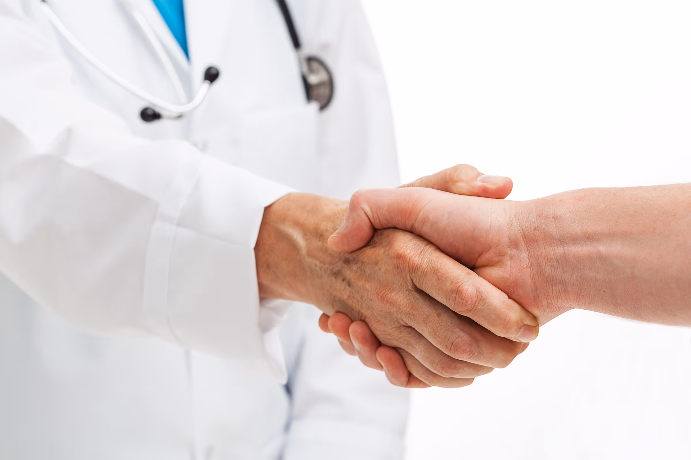 A patient and doctor shaking hands at a dermatology clinic in American Fork, UT