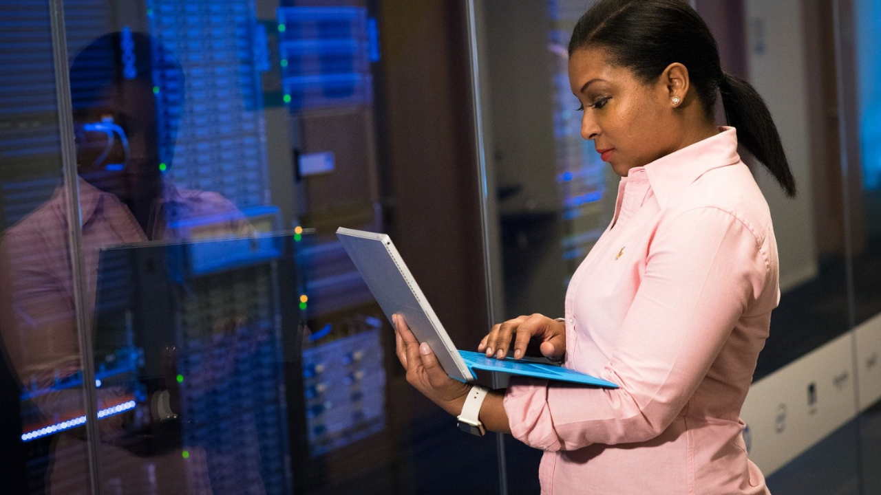 IT professional reviewing server systems for advanced cybersecurity support.
