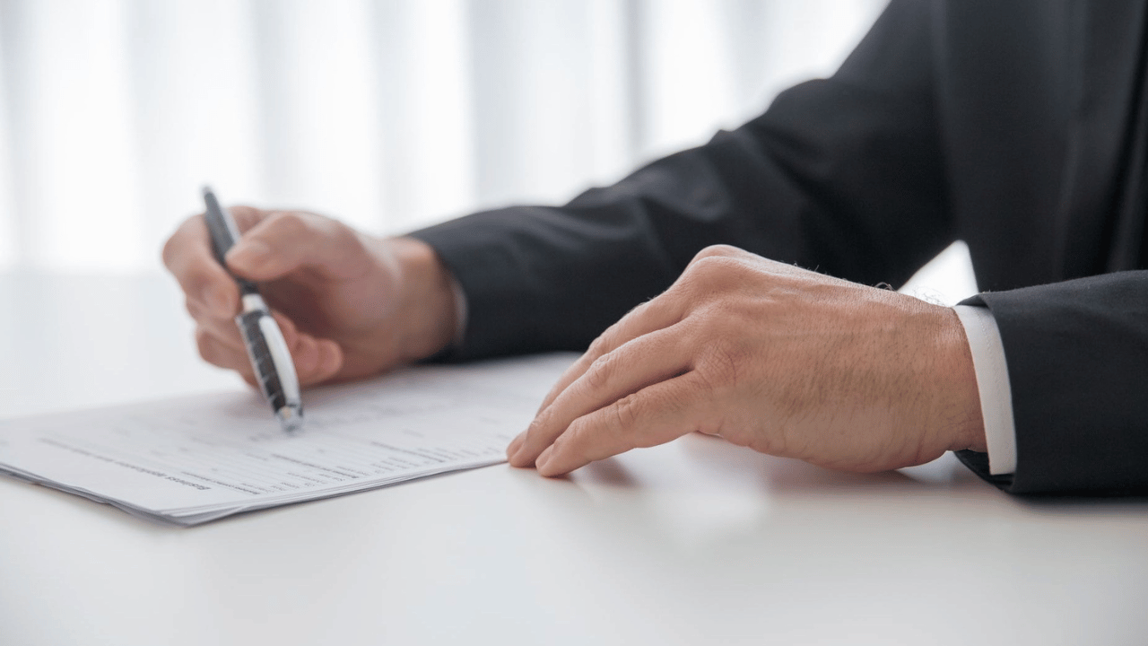 Business professional reviewing managed IT proposals to compare pricing, scope, and responsibilities.