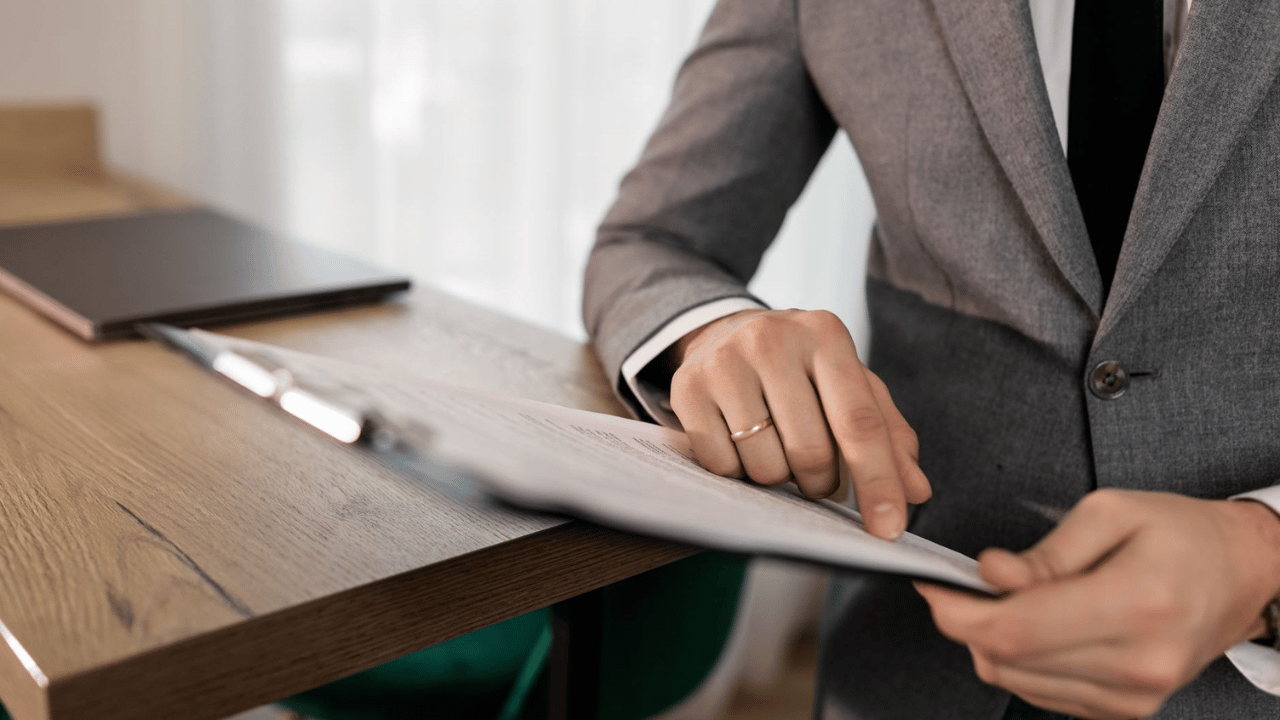Business professional reviewing cybersecurity contract terms, responsibilities, access, and service expectations.