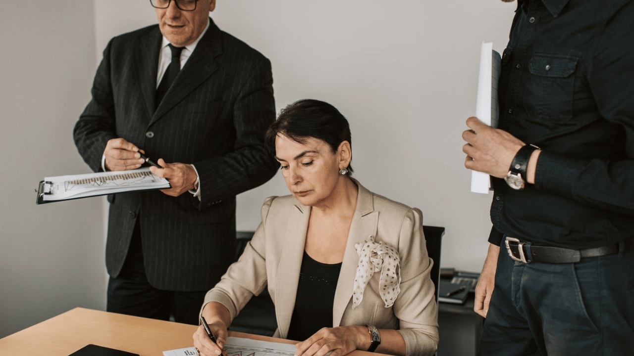 Business team reviewing warning signs and potential risks in a cybersecurity provider agreement.