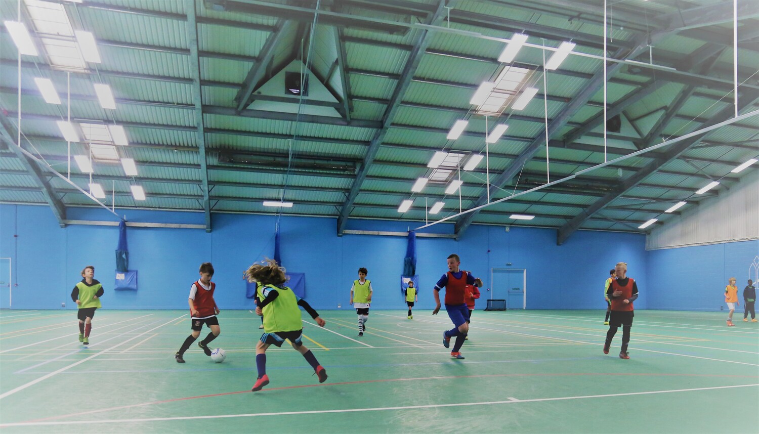 Young players learning football skills in a We Make Footballers session