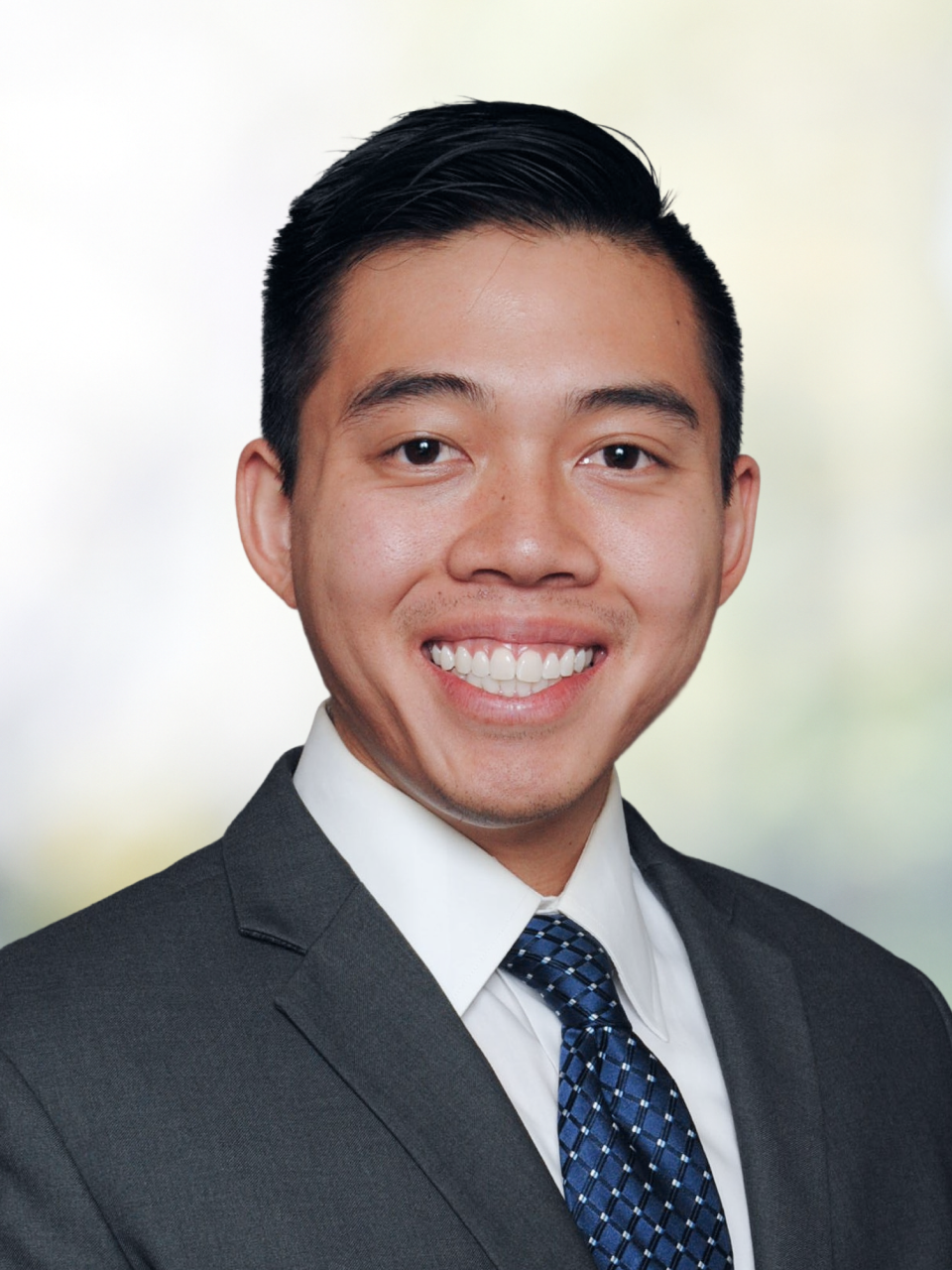 Professional headshot of Andrew Sumarsono