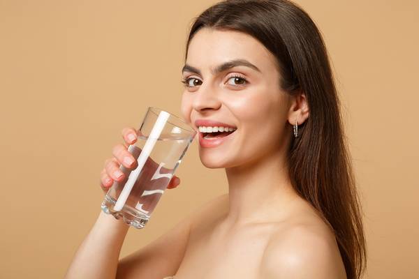Stop oily skin on face by drinking water, eating healthily, and lowering stress levels.