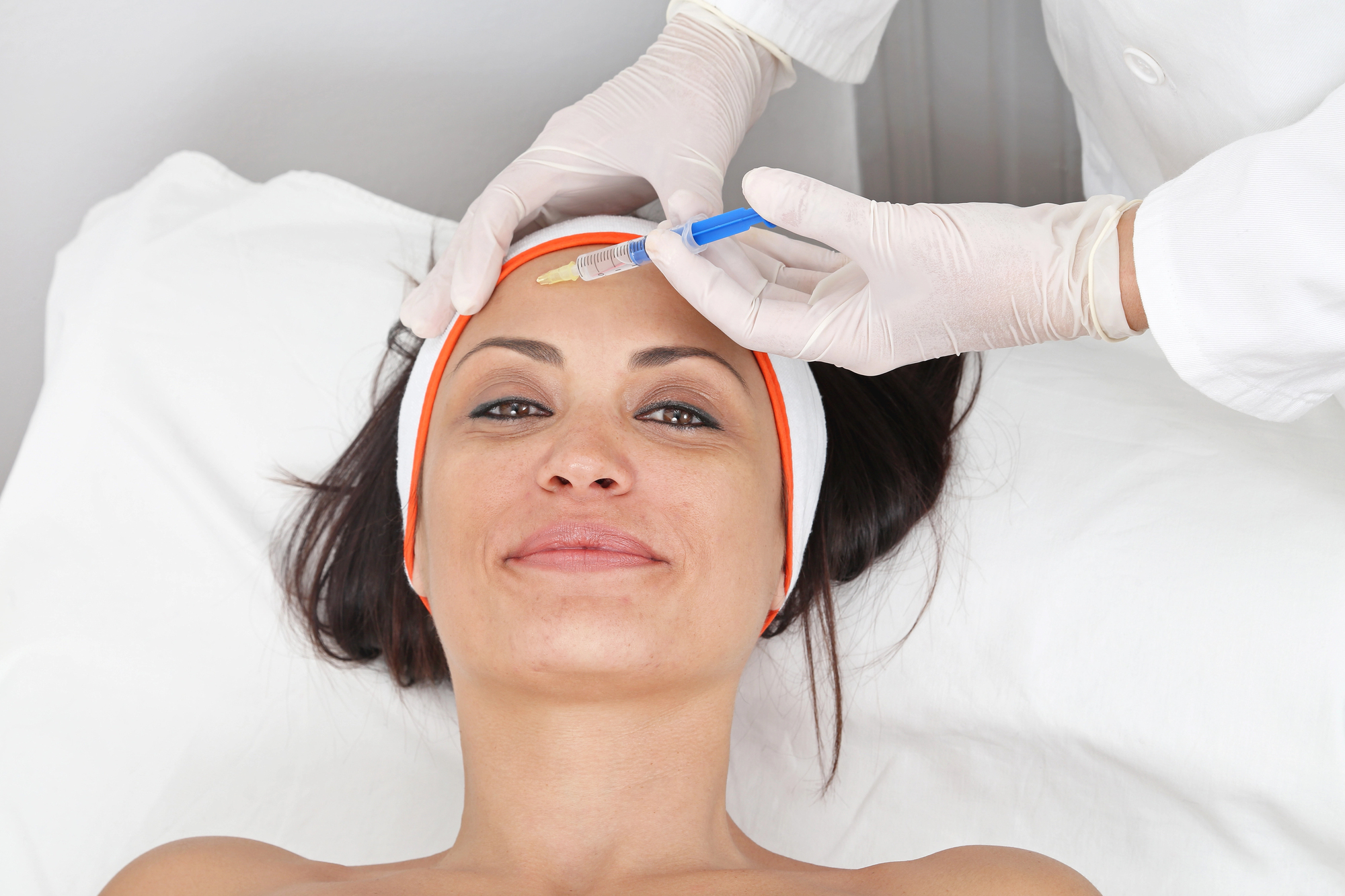 Patient receiving Botox treatment to the forehead during a cosmetic injectable appointment