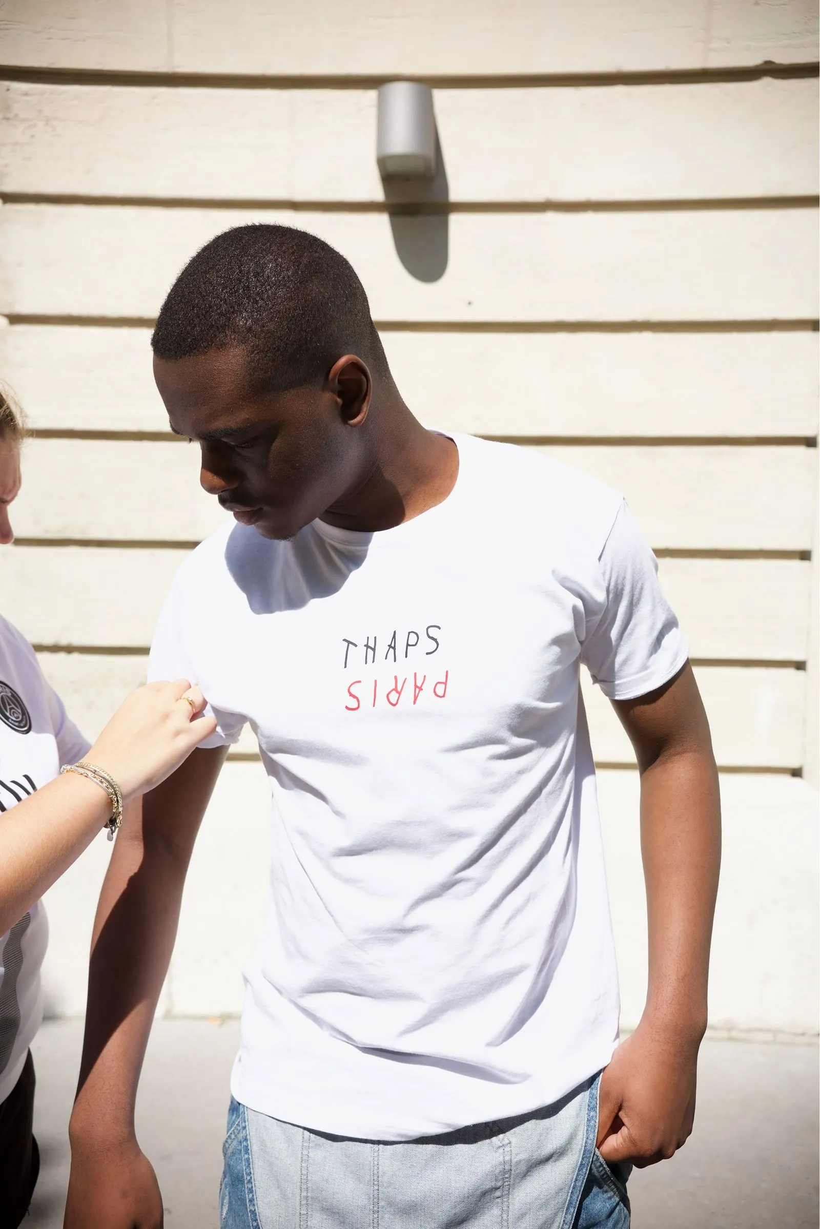 Person_wearing_PARIS_T_shirt